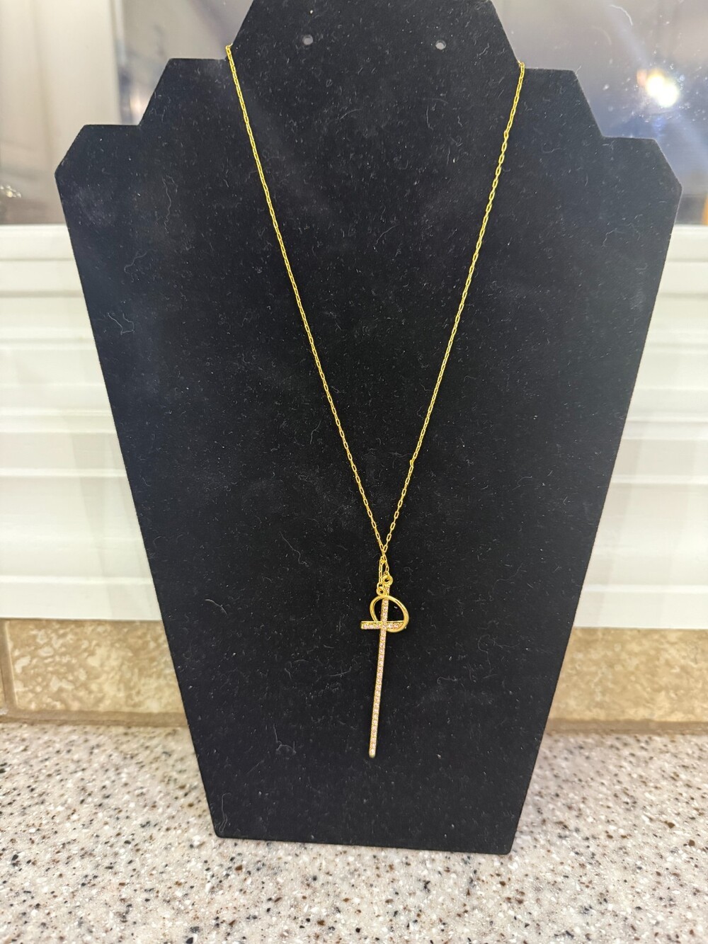 gold tone necklace with cross, pink stones, pendant